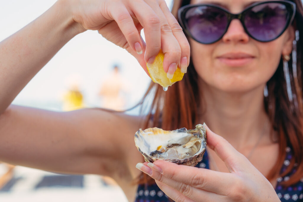girl eating oysters